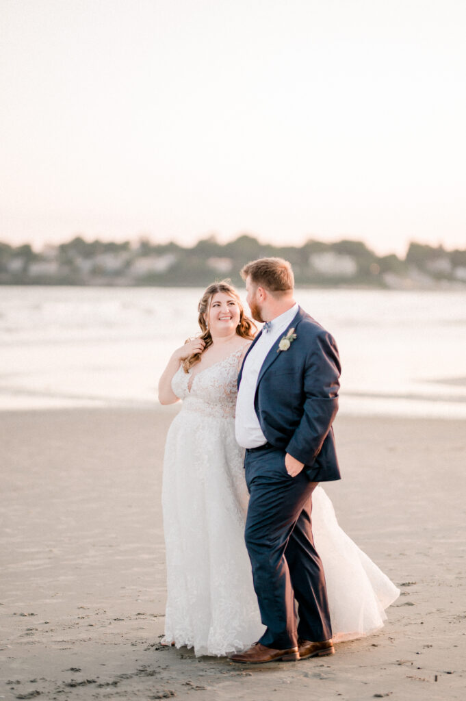A bride and groom at Easton's Beach, also know as Second Beach in Newport, Rhode Island after getting married at Newport Beach House.